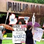 Protesters stood outside a Philip Morris cigarette factory in Richmond, Va., in 1999. The cigarette maker changed its name in 2003 to Altria.